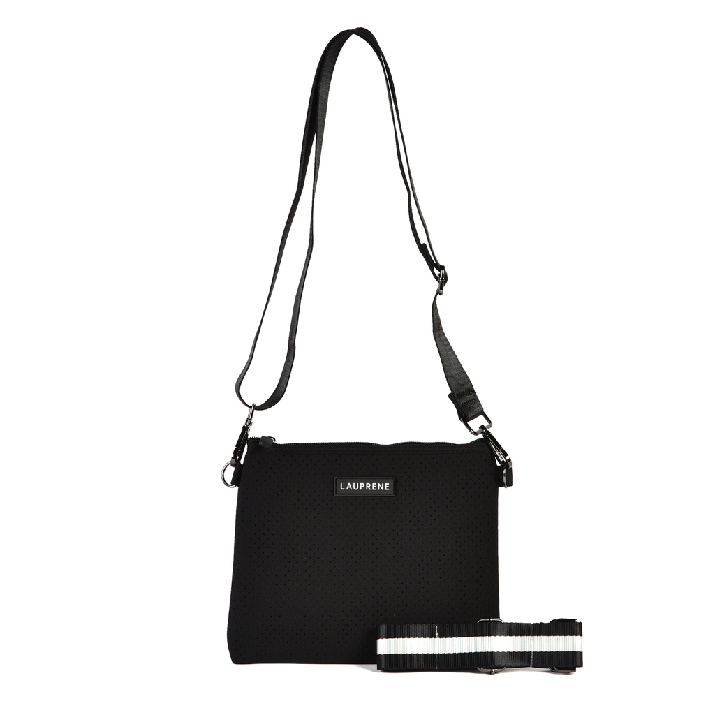 Lauprene black neoprene cross body messenger bag with a solid black adjustable strap and an additional black and white stripe adjustable strap