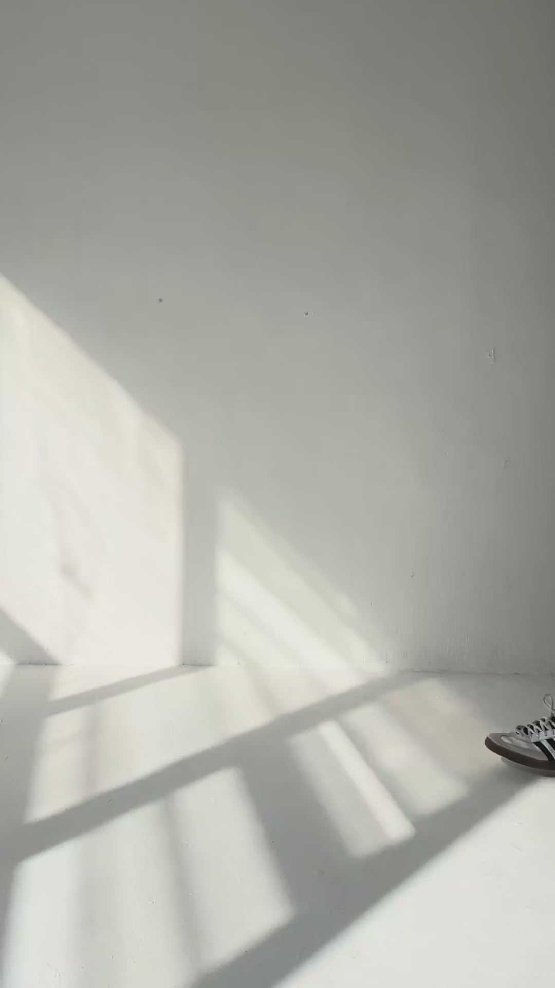 A girl walking with an Urban chocolate neoprene tote in a white studio
