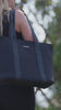 Urban Black tote with Carla Orr in her gym kit in the forest