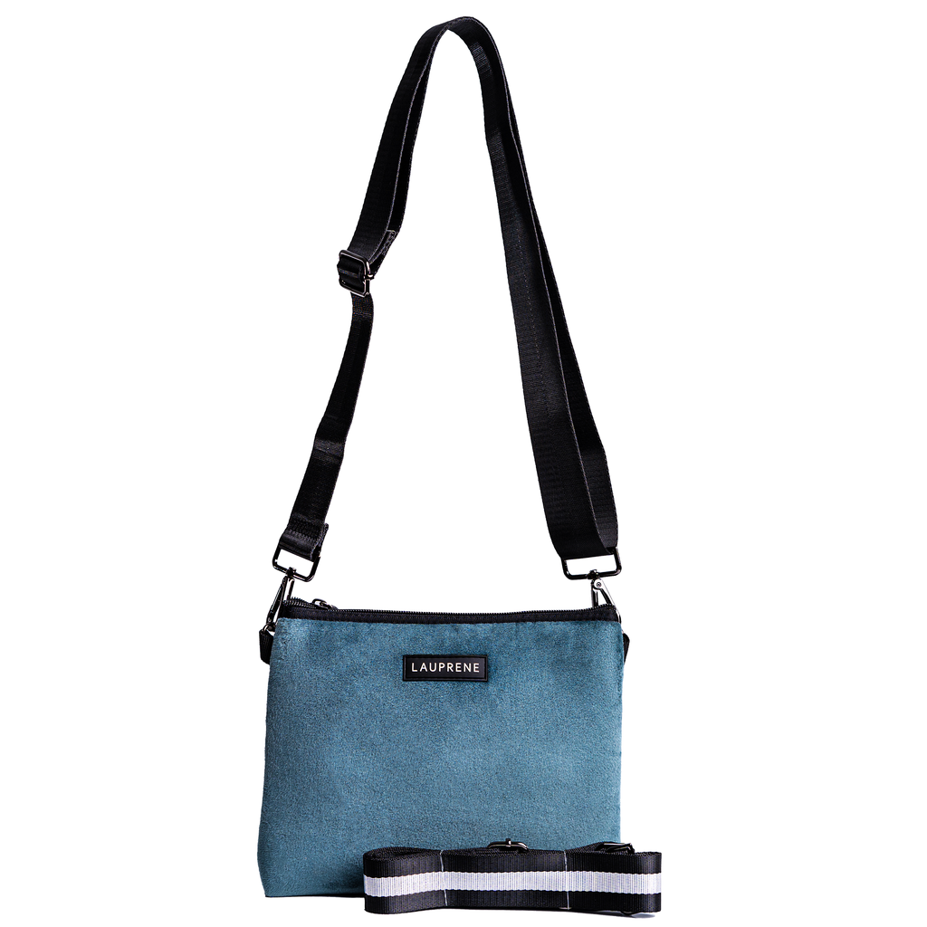 Teal neoprene velvet cross body messenger bag with a black strap and an additional black and white straps